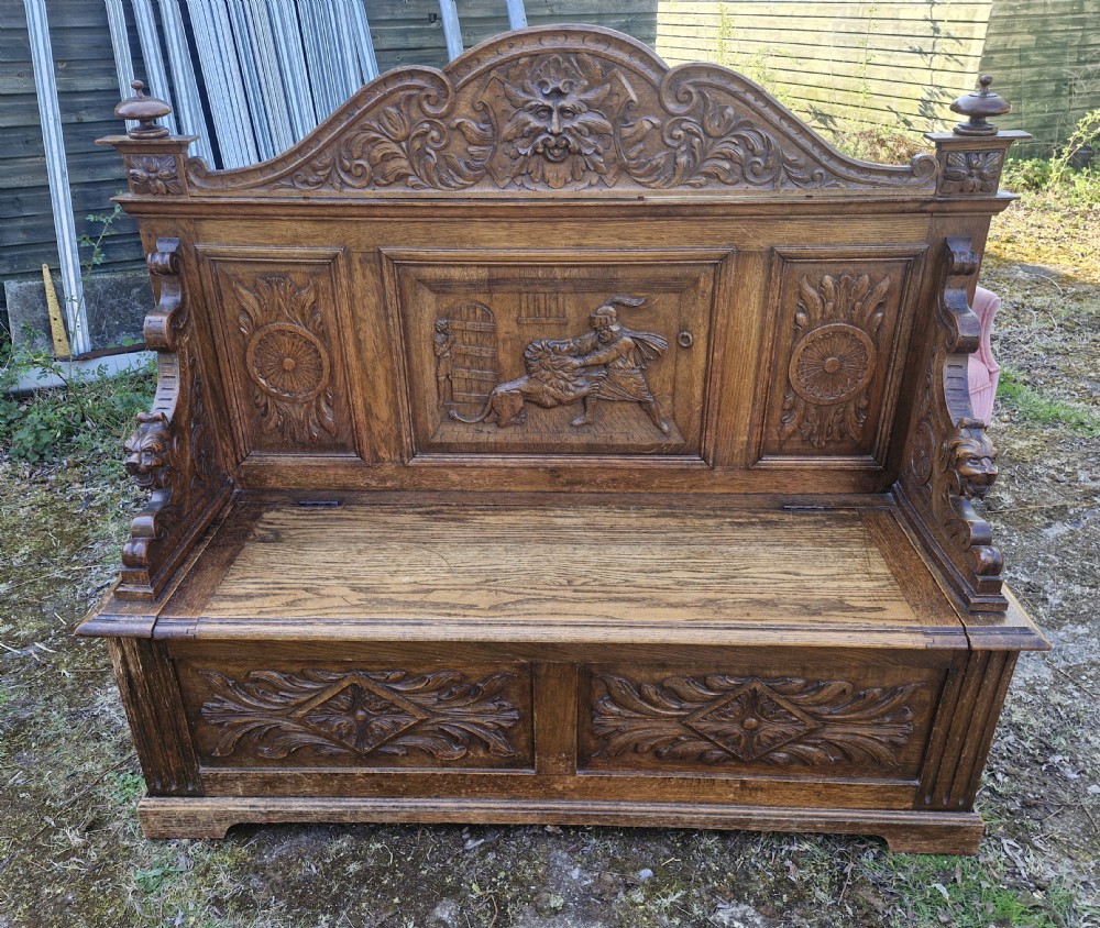 Late Victorian carved oak hall seat with storage seat. View VIII