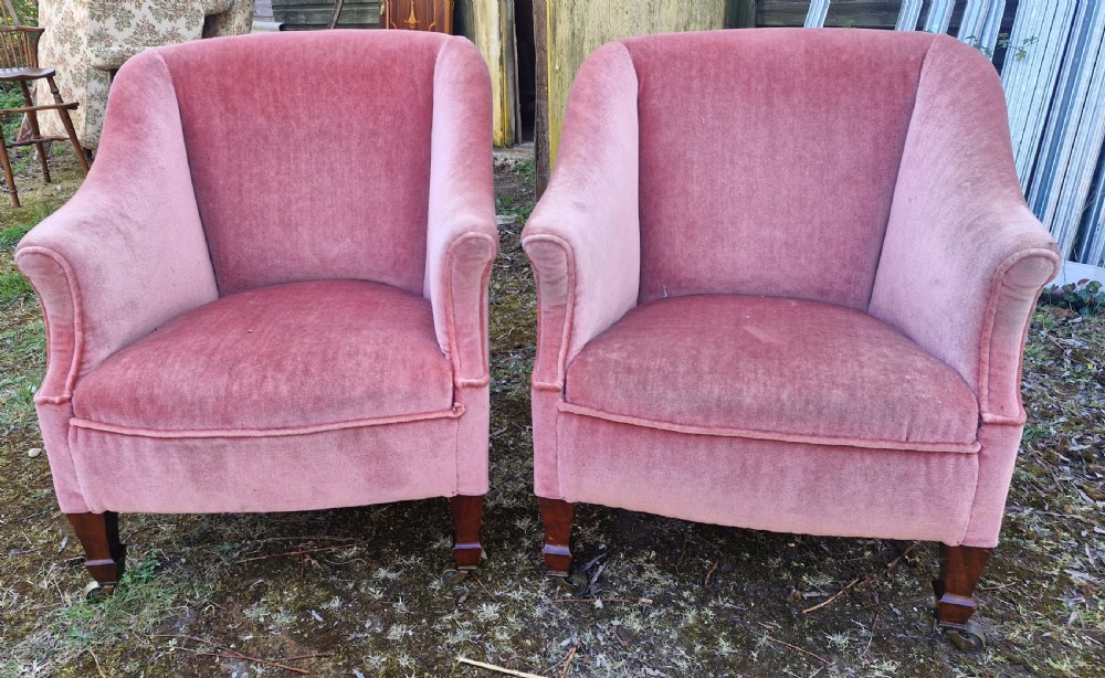 Pair of Edwardian mahogany upholstered armchairs with maker's stamp. 