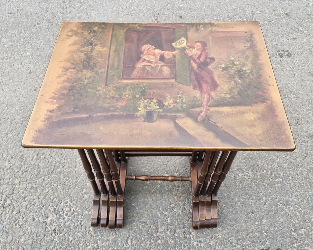 Nest of 4 early 20th century decorated occasional tables.