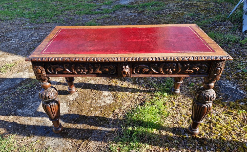 Victorian carved oak 2 drawer writing table. 