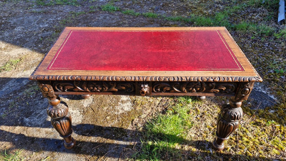 Victorian carved oak 2 drawer writing table.  View IX