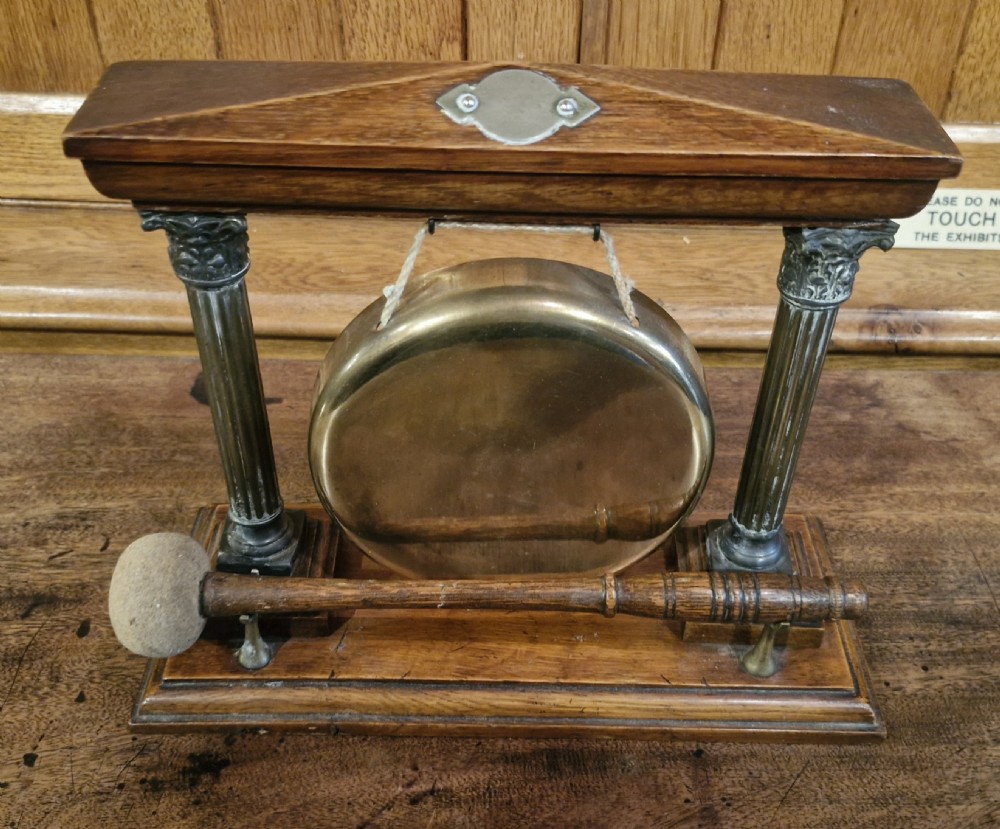 Edwardian oak table top dinner gong. 