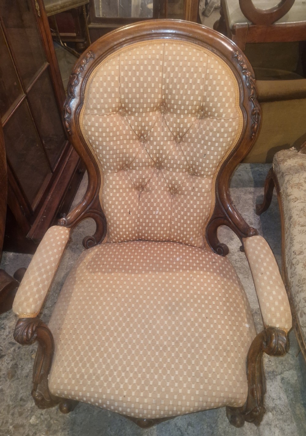 Victorian carved walnut upholstered spoon back armchair.  View II