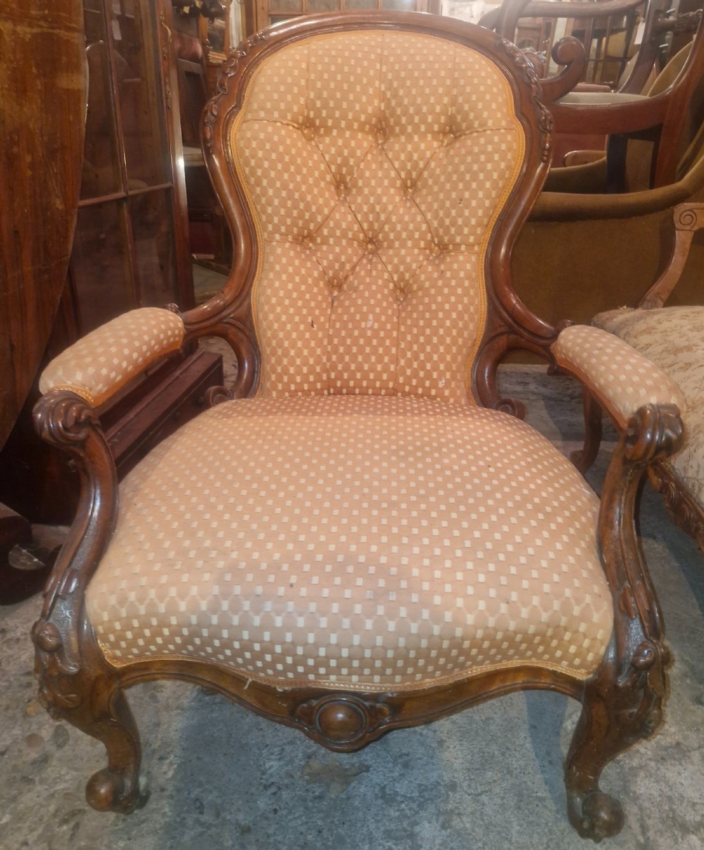 Victorian carved walnut upholstered spoon back armchair.  View III