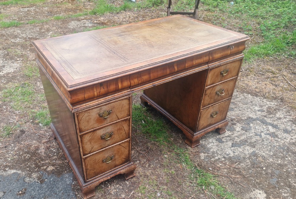 Walnut and Yewwood pedestal writing desk. 