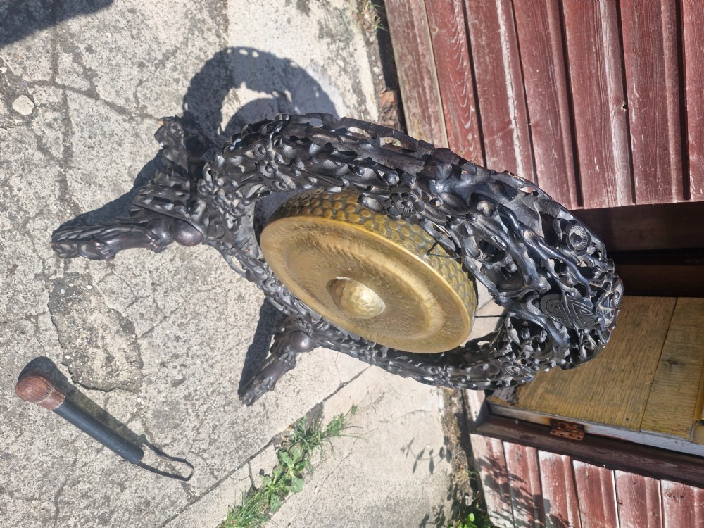 Carved Oriental table top dinner gong.  View VII