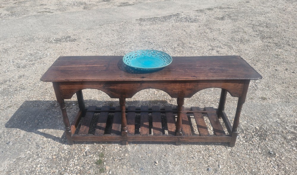18th century vernacular oak serving table. View XVIII