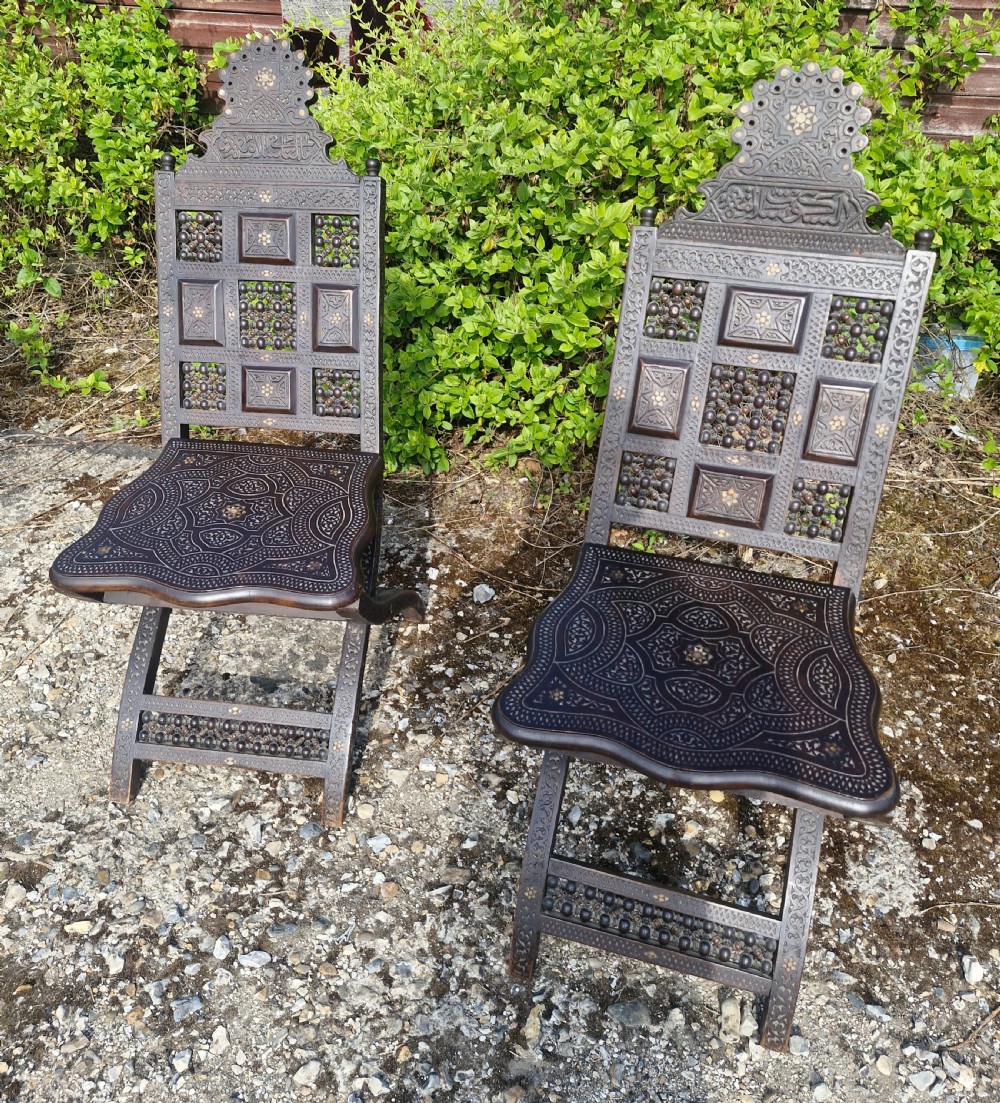 Pair of Late 19th century Moorish folding hall chairs. 