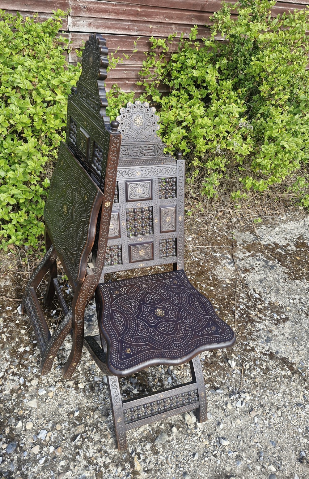 Pair of Late 19th century Moorish folding hall chairs.  View II
