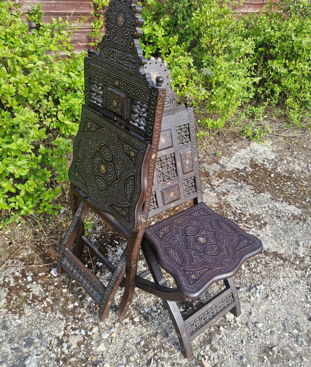 Pair of Late 19th century Moorish folding hall chairs.  View IV