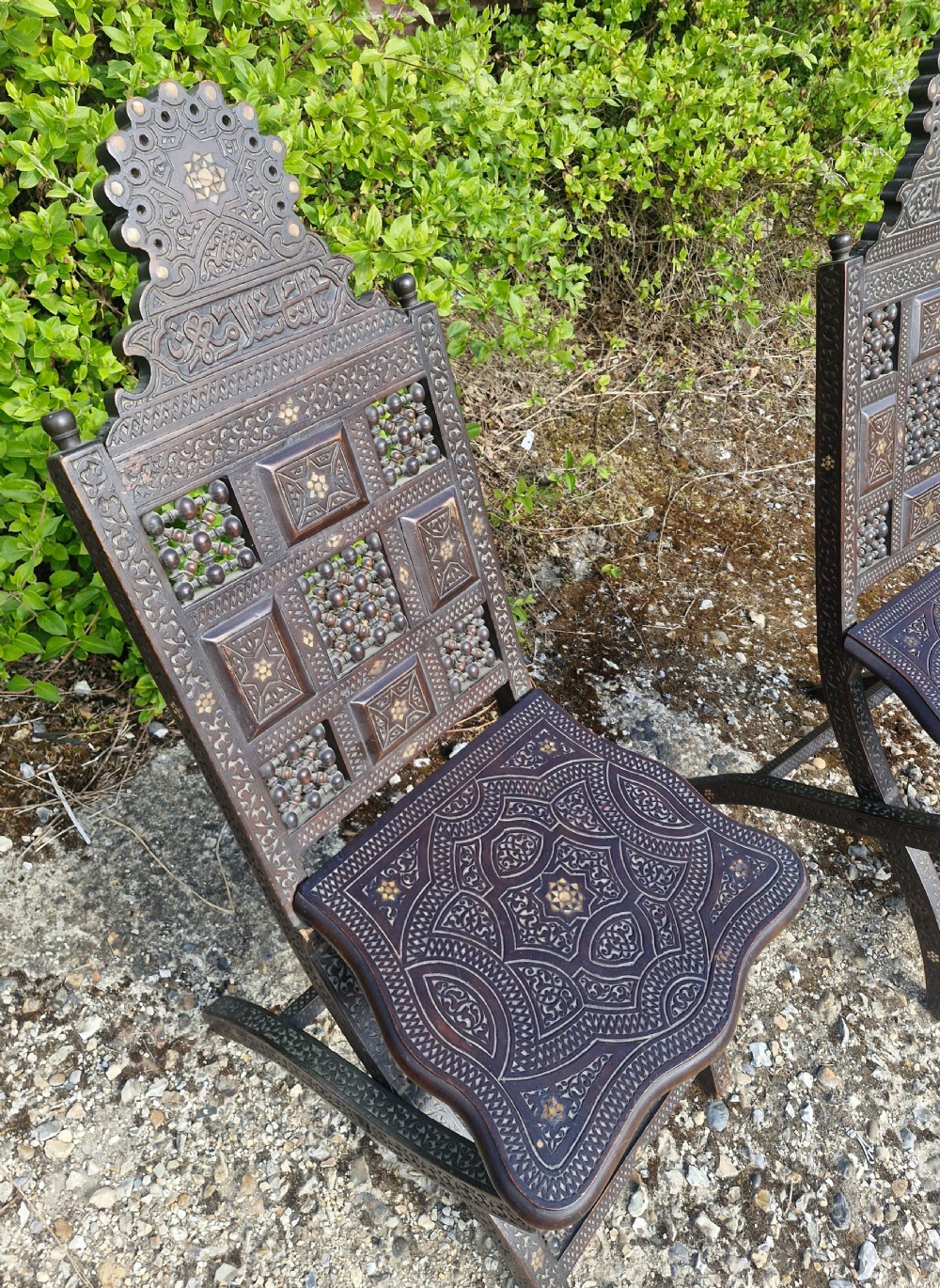 Pair of Late 19th century Moorish folding hall chairs.  View V