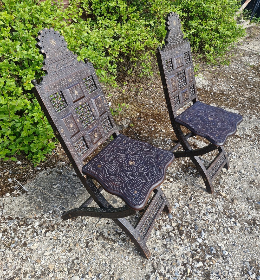 Pair of Late 19th century Moorish folding hall chairs.  View VI