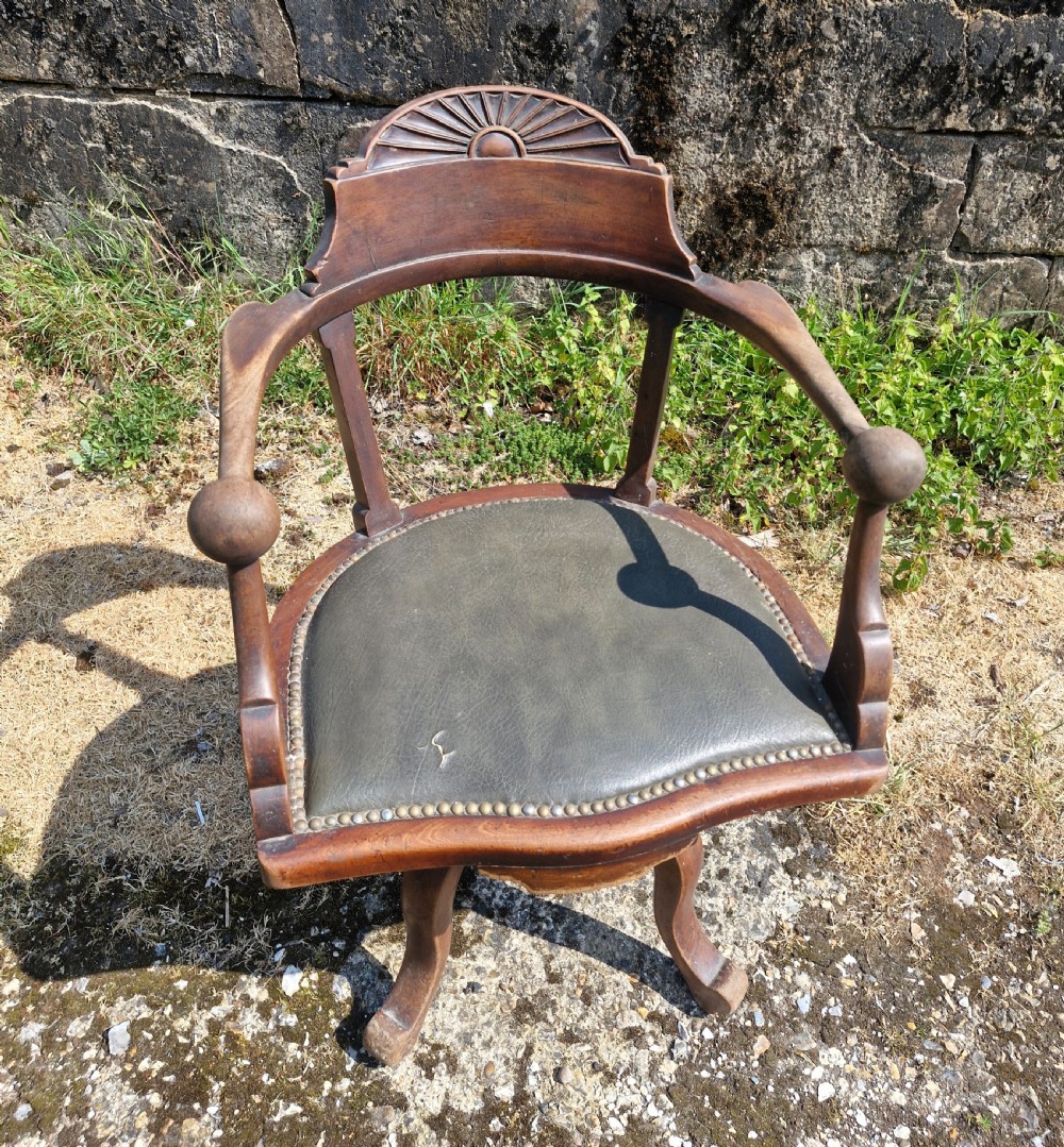 Late Victorian mahogany revolving desk armchair. 