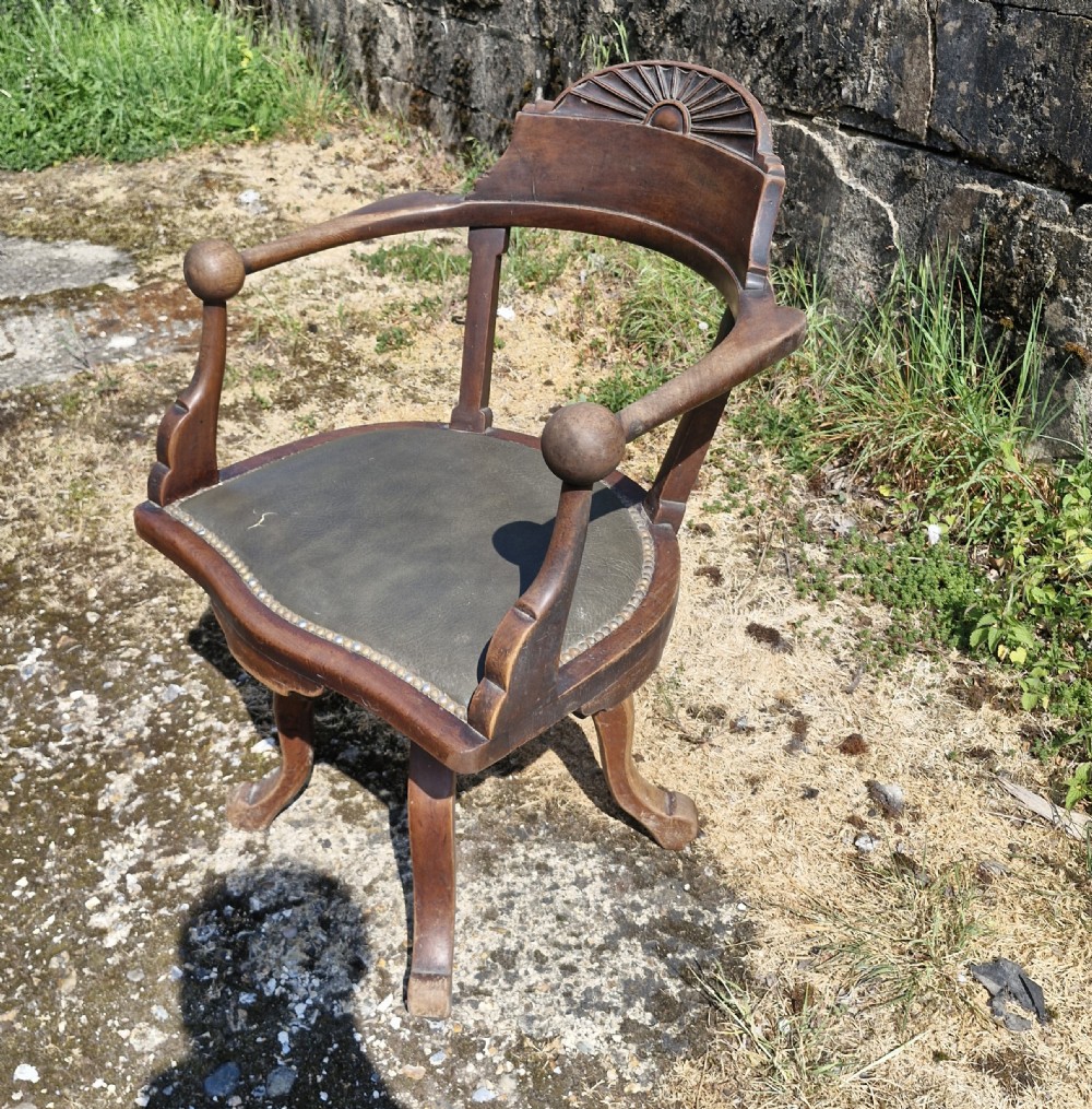 Late Victorian mahogany revolving desk armchair.  View V
