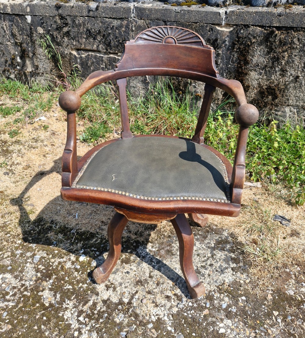 Late Victorian mahogany revolving desk armchair.  View VI