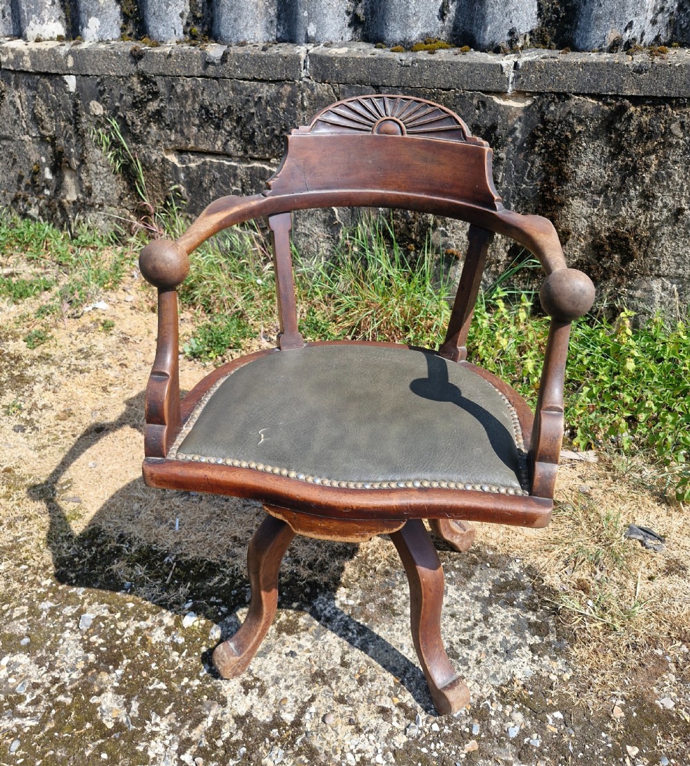 Late Victorian mahogany revolving desk armchair.  View VII