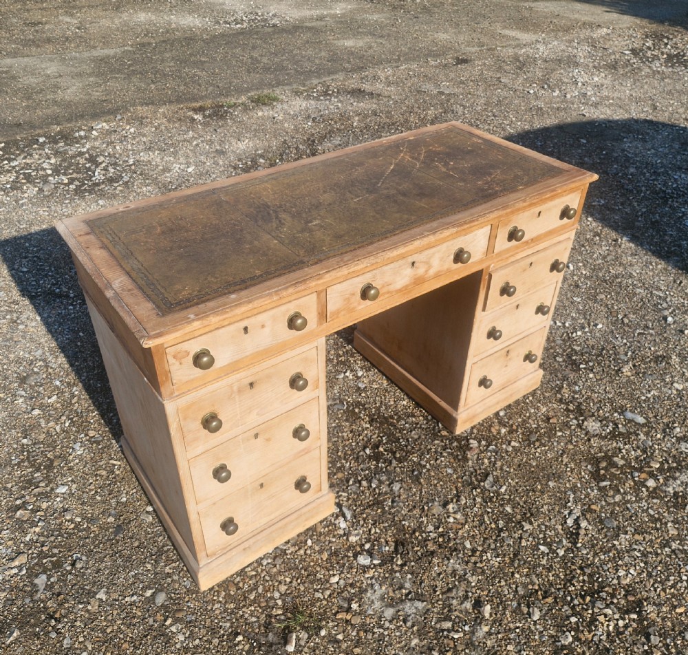 Late Victorian pine kneehole pedestal writing desk. 