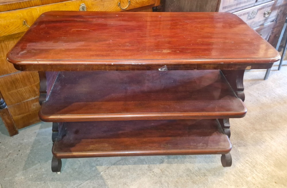 A mid-19th-century mahogany three-tier etagere featuring rounded rectangular shelves supported by carved S-scroll uprights. View III