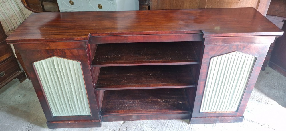 Regency mahogany inverted library bookcase cabinet fitted shelves and drawers. 