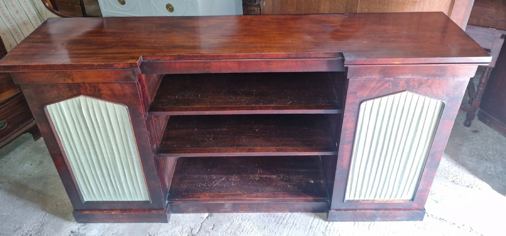 Regency mahogany inverted library bookcase cabinet fitted shelves and drawers.  View VI