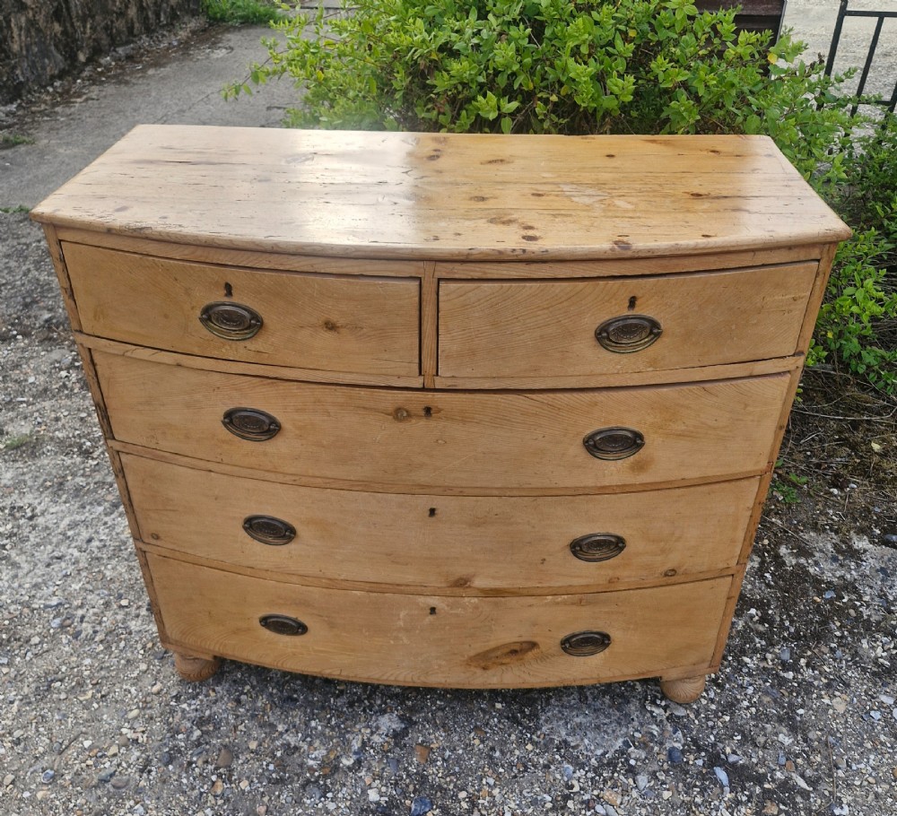 Early Victorian pine bow front chest of drawers. 