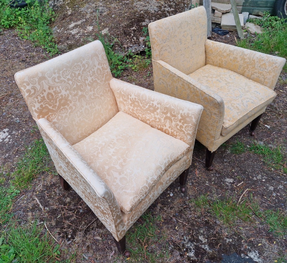 Pair of Edwardian upholstered drawing room armchairs. View III