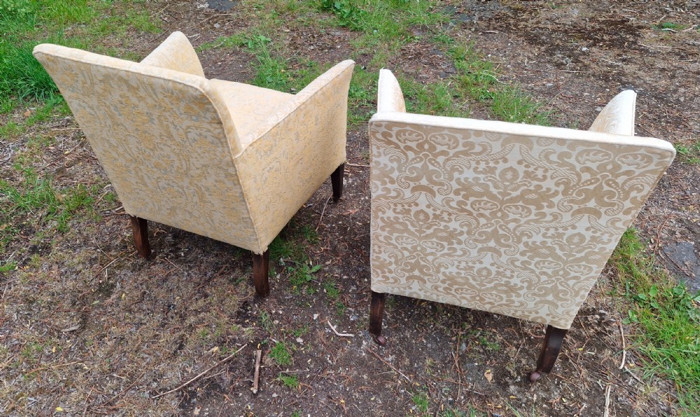 Pair of Edwardian upholstered drawing room armchairs. View V