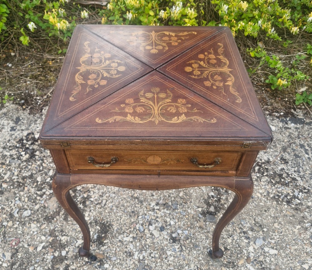 Edwardian inlaid mahogany swivel top games table. 