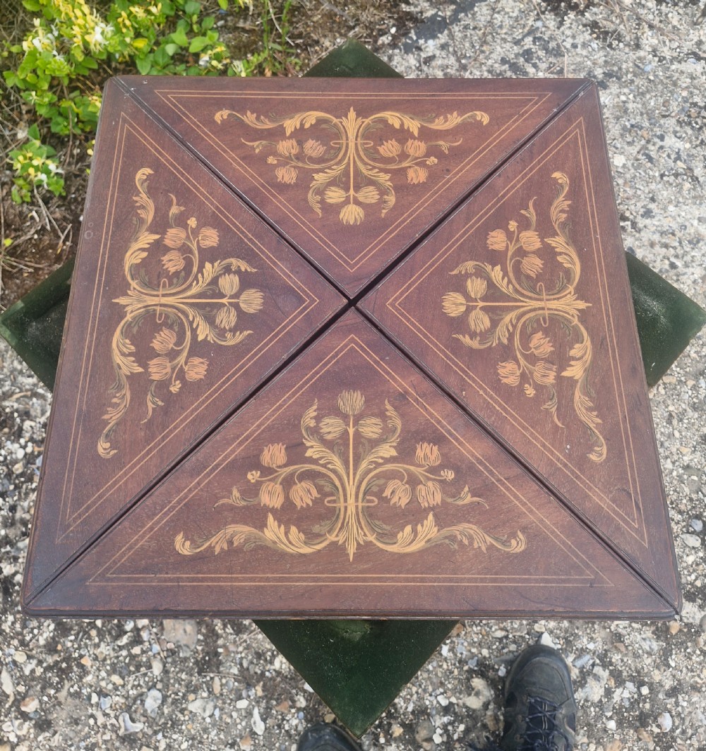 Edwardian inlaid mahogany swivel top games table.  View II