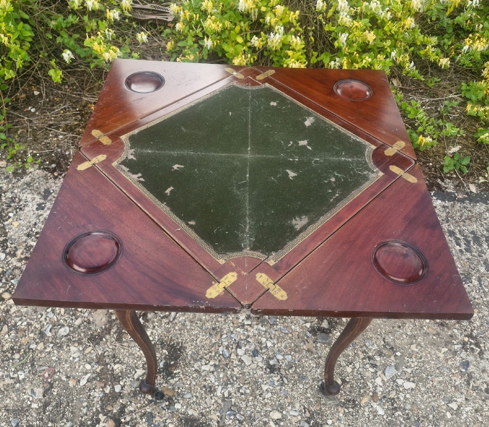 Edwardian inlaid mahogany swivel top games table.  View V