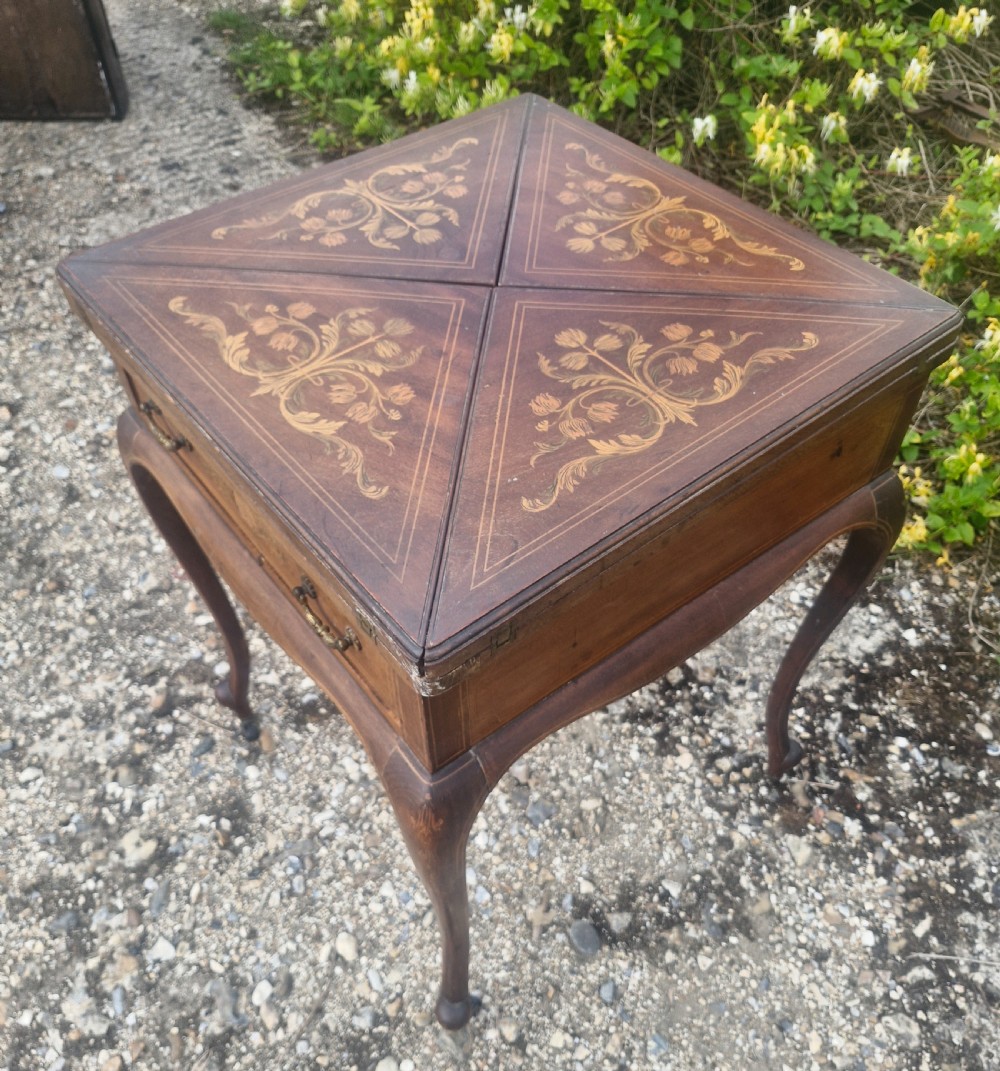 Edwardian inlaid mahogany swivel top games table.  View VII