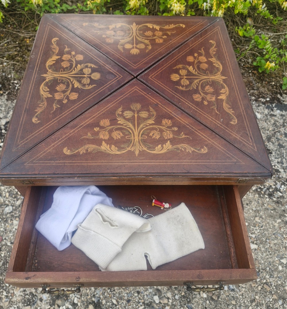 Edwardian inlaid mahogany swivel top games table.  View VIII