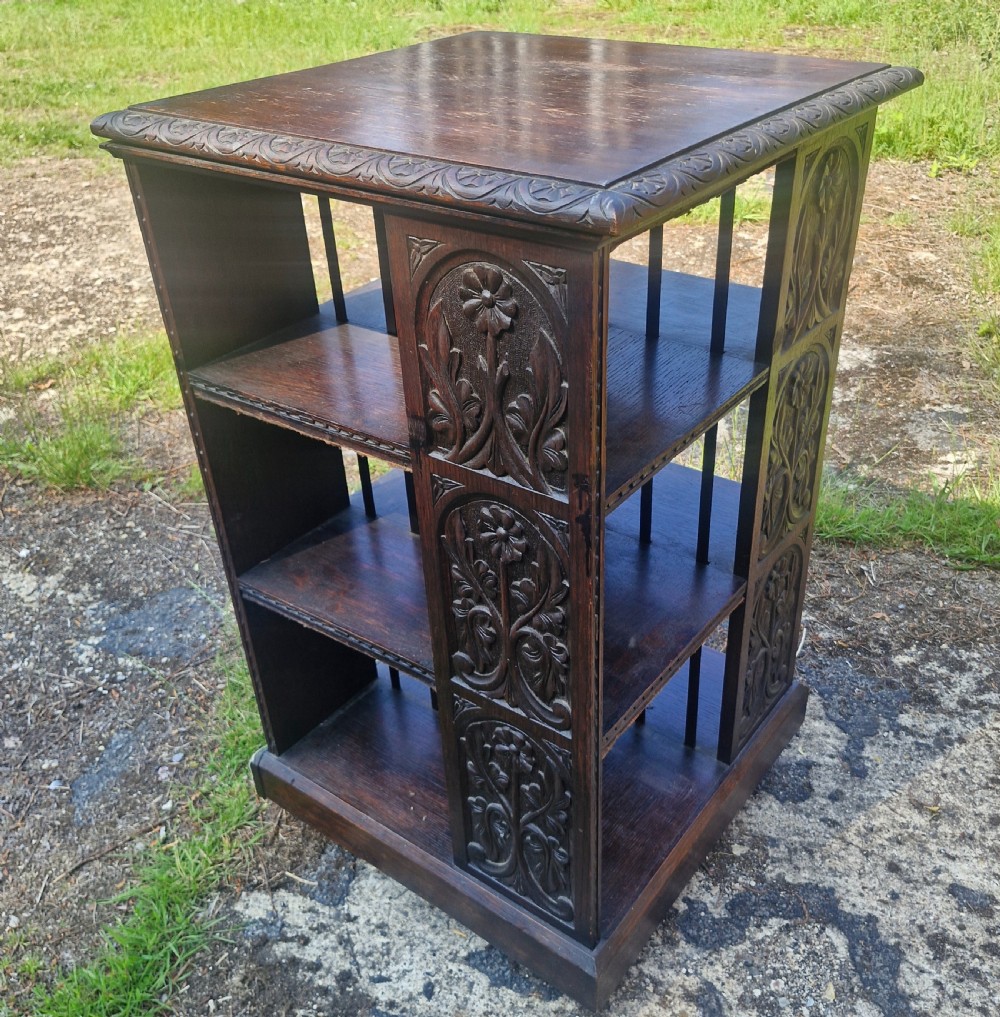 Late Victorian carved oak revolving bookcase. 