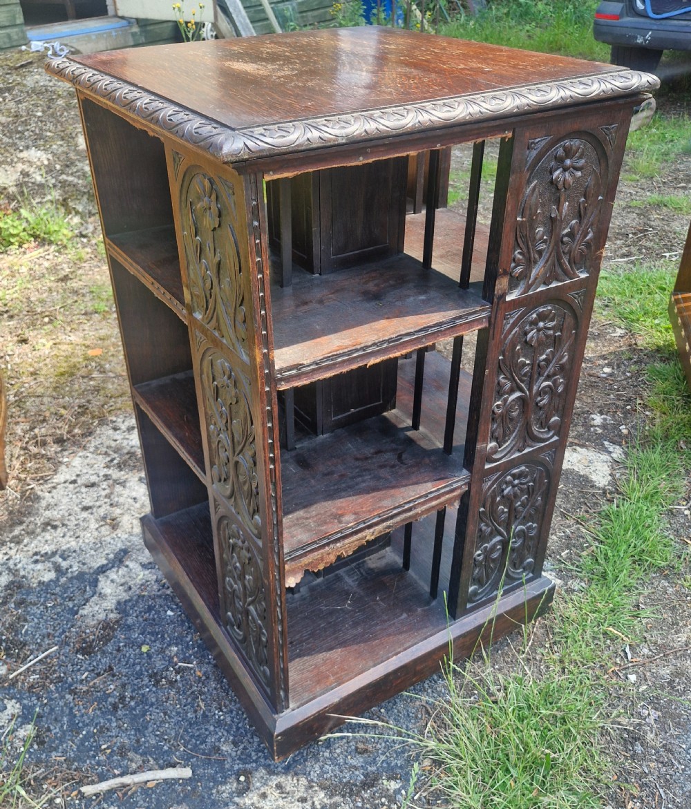 Late Victorian carved oak revolving bookcase.  View IV