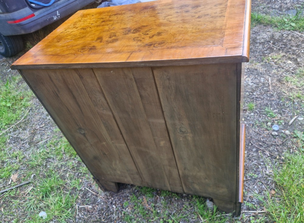 Early 20th century walnut chest of drawers with brushing slide.  View V