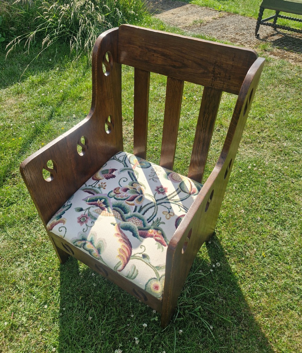 Oak Goodyer's arts and crafts armchair.  View IV