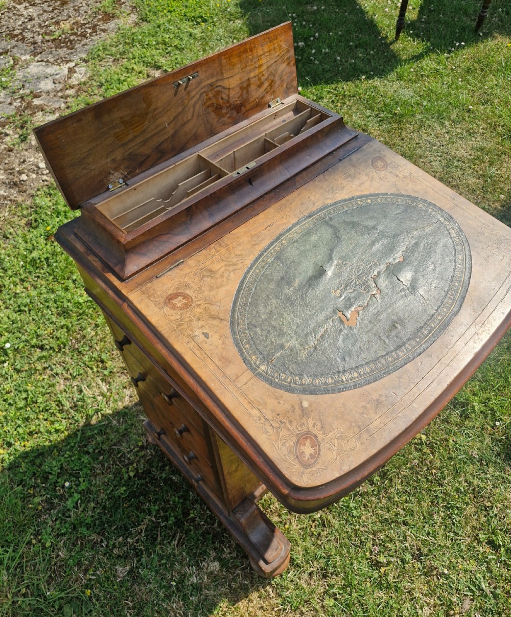 A Victorian walnut Davenport desk featuring a green leather writing slope, floral marquetry inlay, a raised top stationery box, and four side drawers. View III