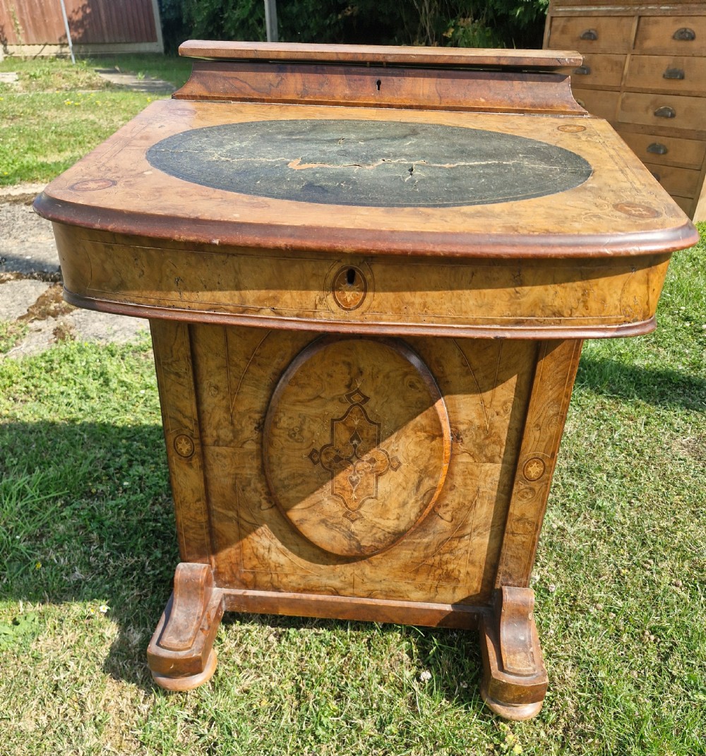 A Victorian walnut Davenport desk featuring a green leather writing slope, floral marquetry inlay, a raised top stationery box, and four side drawers. View VI