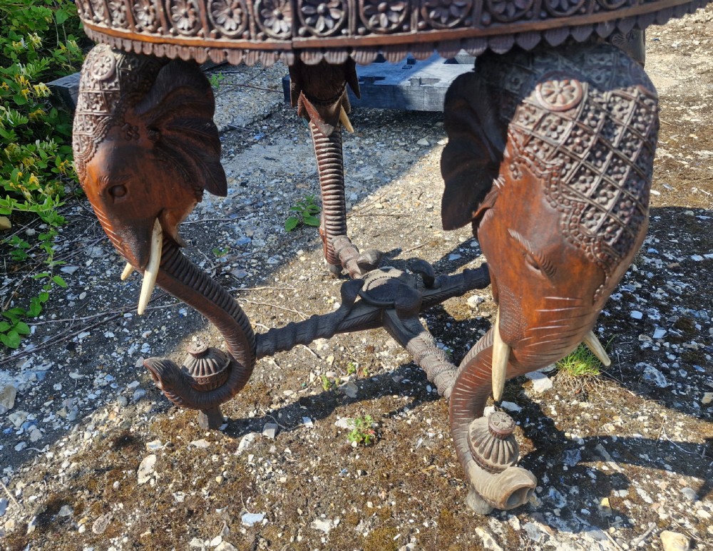 Large Carved Anglo Indian elephant table with wooden tusks. View II