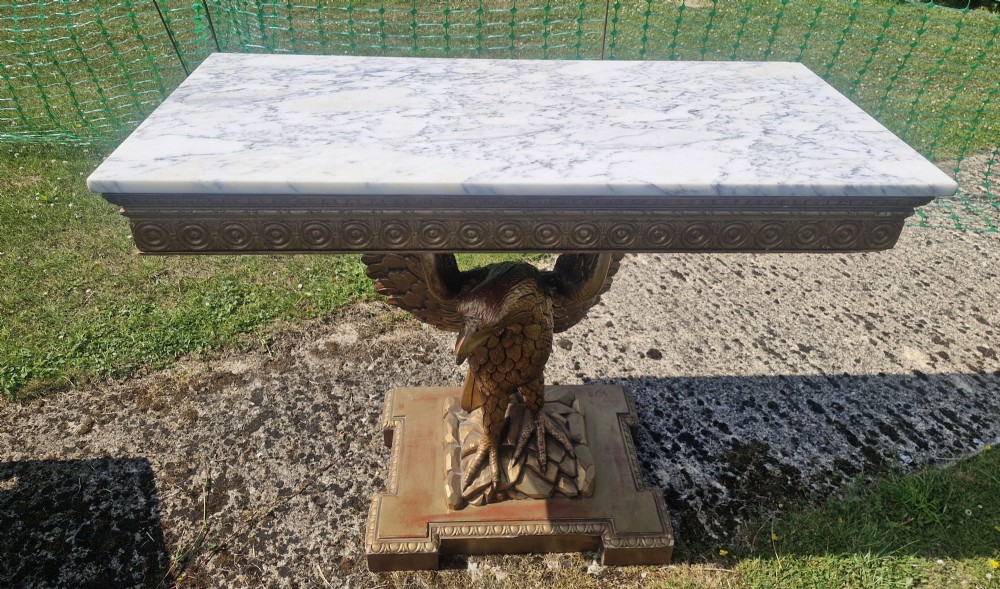 Marble top carved eagle console table.