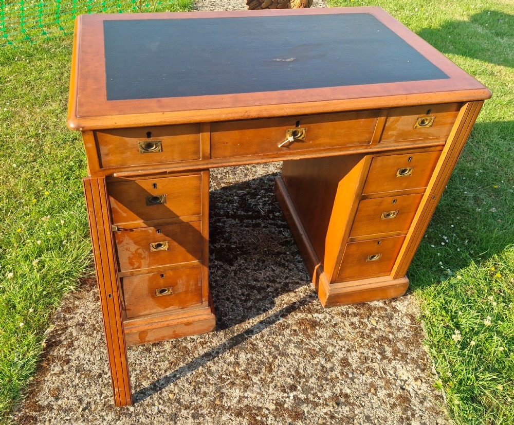 Small kneehole pedestal desk with Wellington type locking drawers. View VII