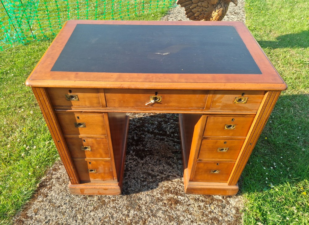 Small kneehole pedestal desk with Wellington type locking drawers. View VIII