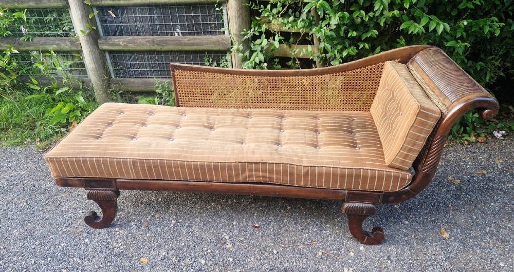Caned chaise Longue with loose cushions. 