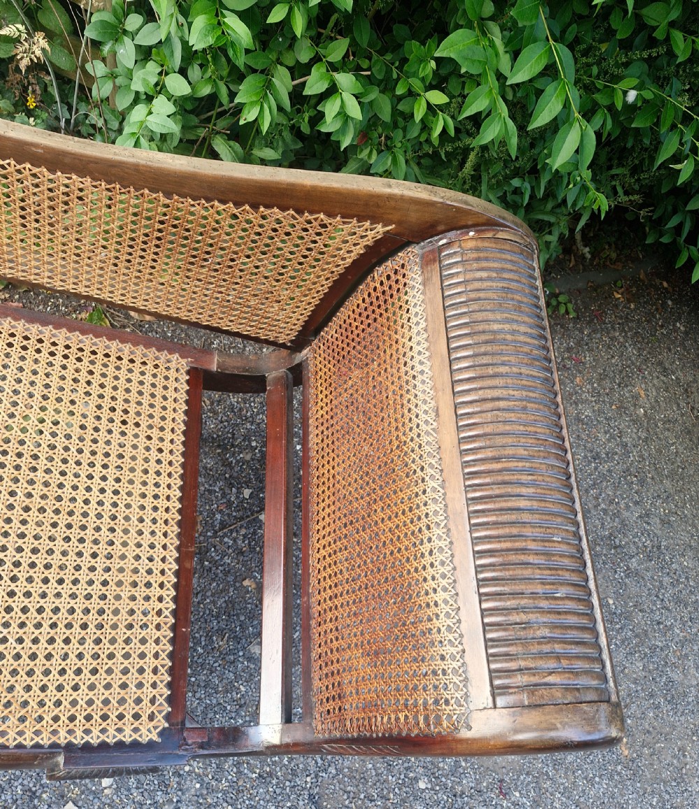 Caned chaise Longue with loose cushions.  View IX
