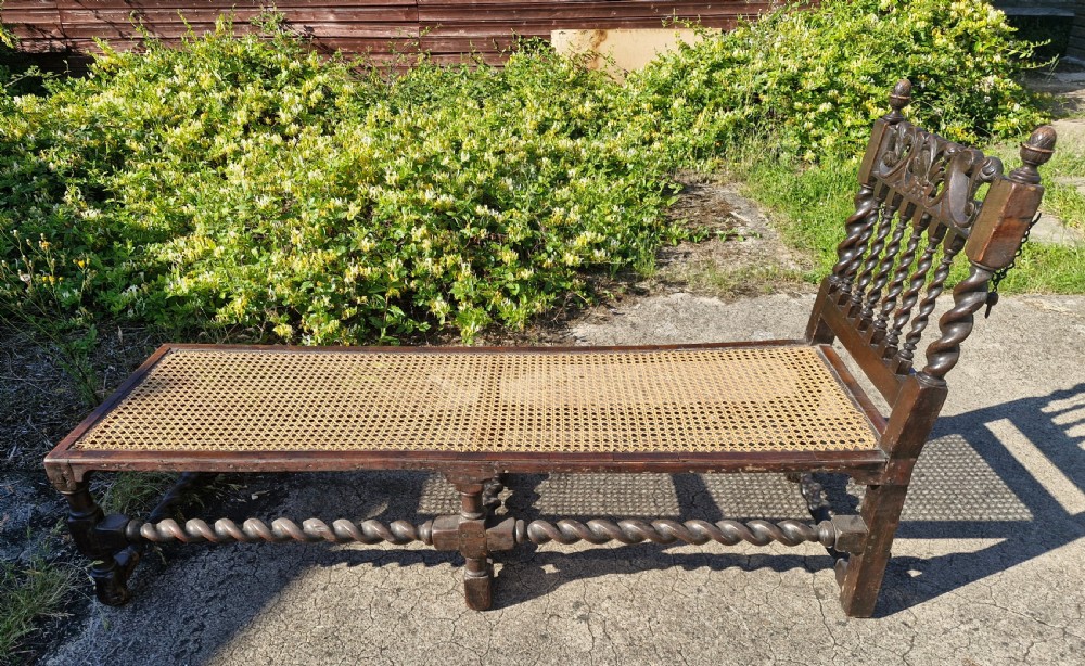 Early 18th century oak and walnut caned day bed. View V