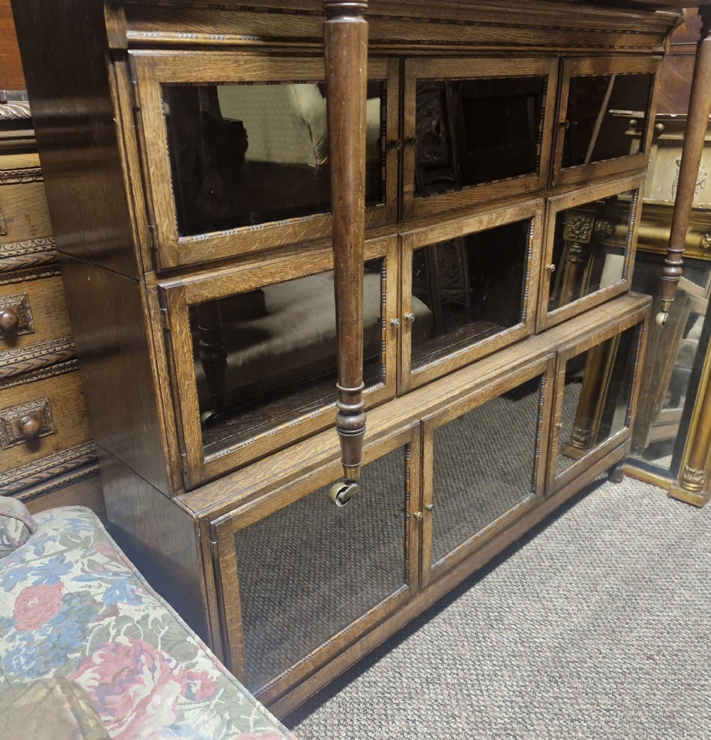 Oak 3 section glazed Minty Oxford bookcase.  View IV