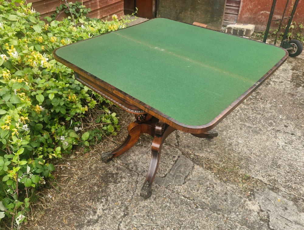 Regency rosewood swivel top games table in the manner of William Trotter. View III