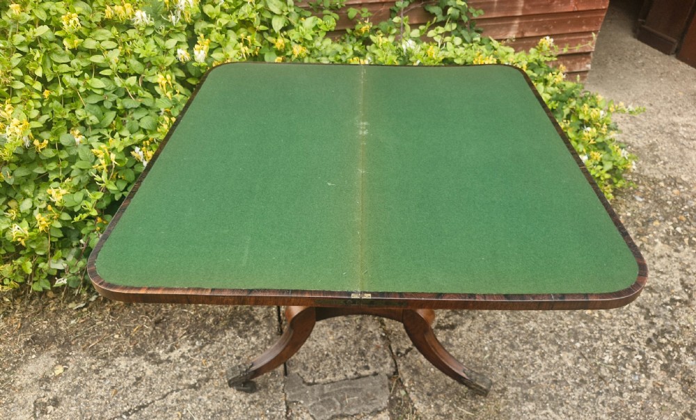 Regency rosewood swivel top games table in the manner of William Trotter. View V