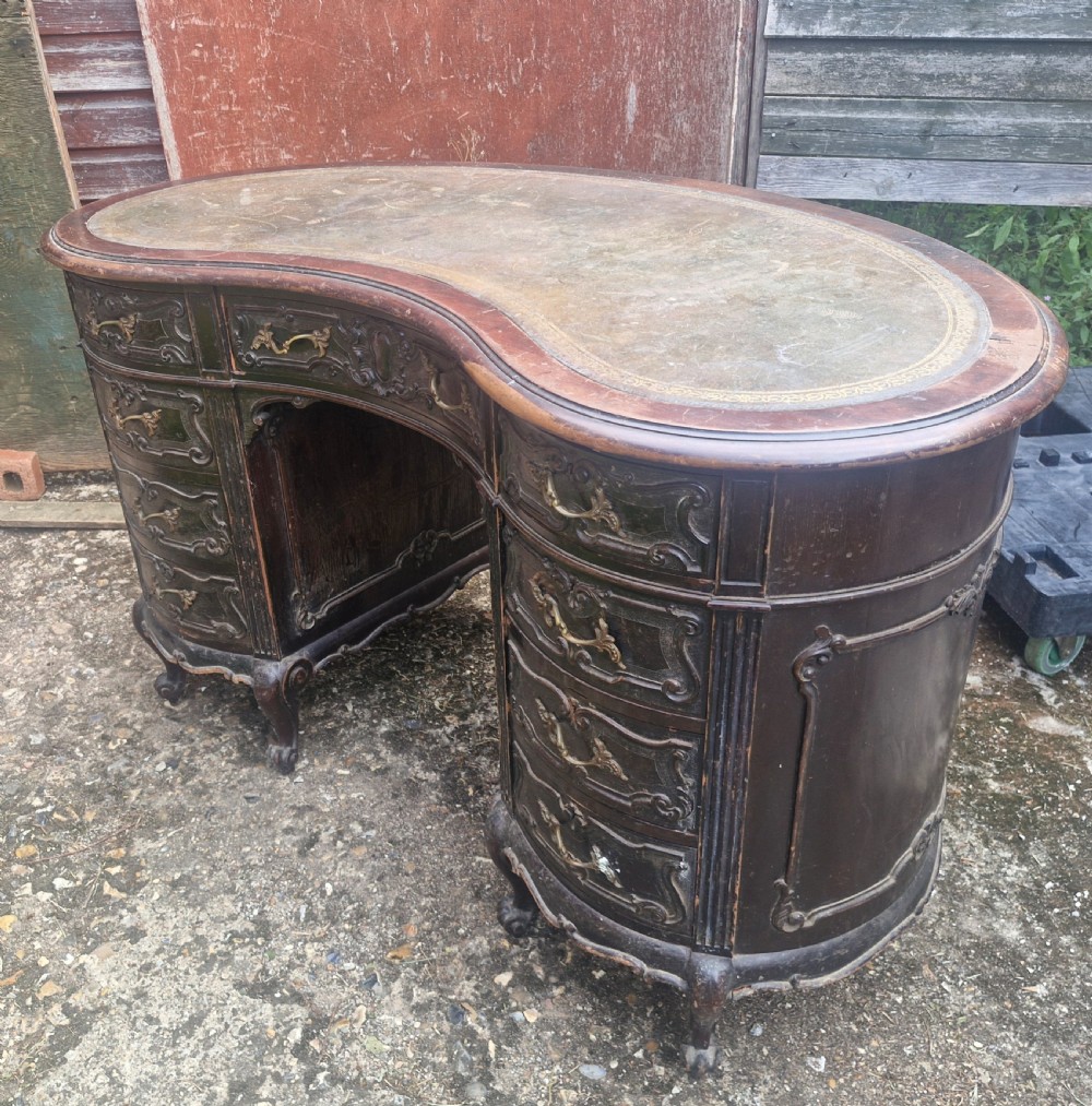 Mahogany kidney shaped writing desk by Maple&Co.