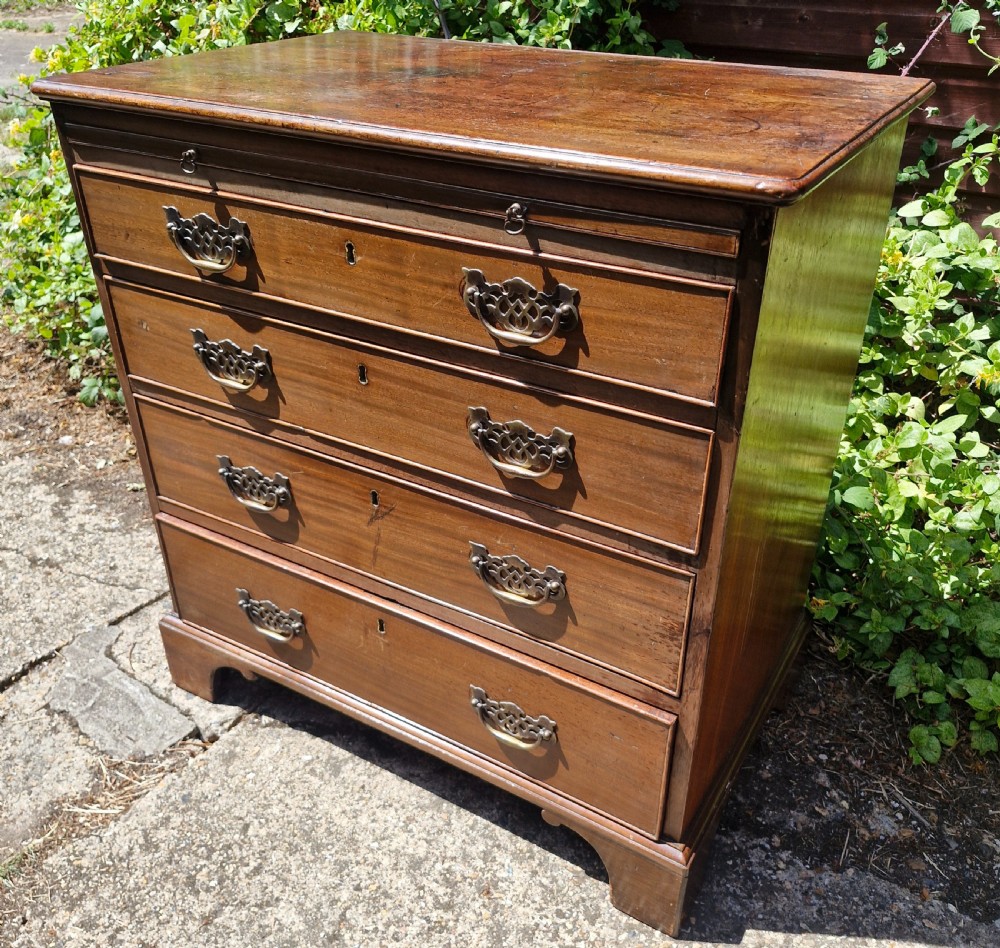 18th century chest of drawers with slide.